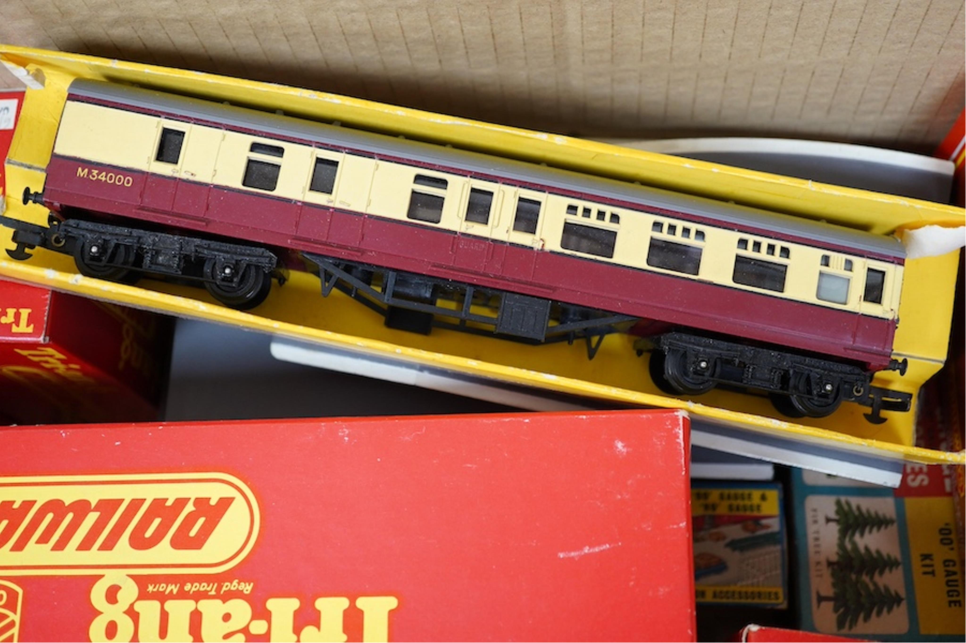 A quantity of mainly boxed Tri-ang 00 gauge railway items including; a BR Princess Royal Class locomotive, freight wagons, ticket office, etc. together with some trackside accessories and figures, etc., in Merit boxes. C